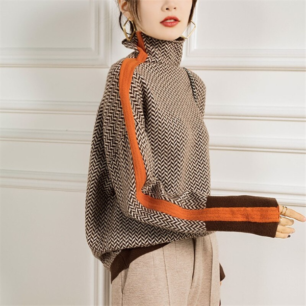 Women's herringbone turtleneck sweater with orange and brown contrast trim