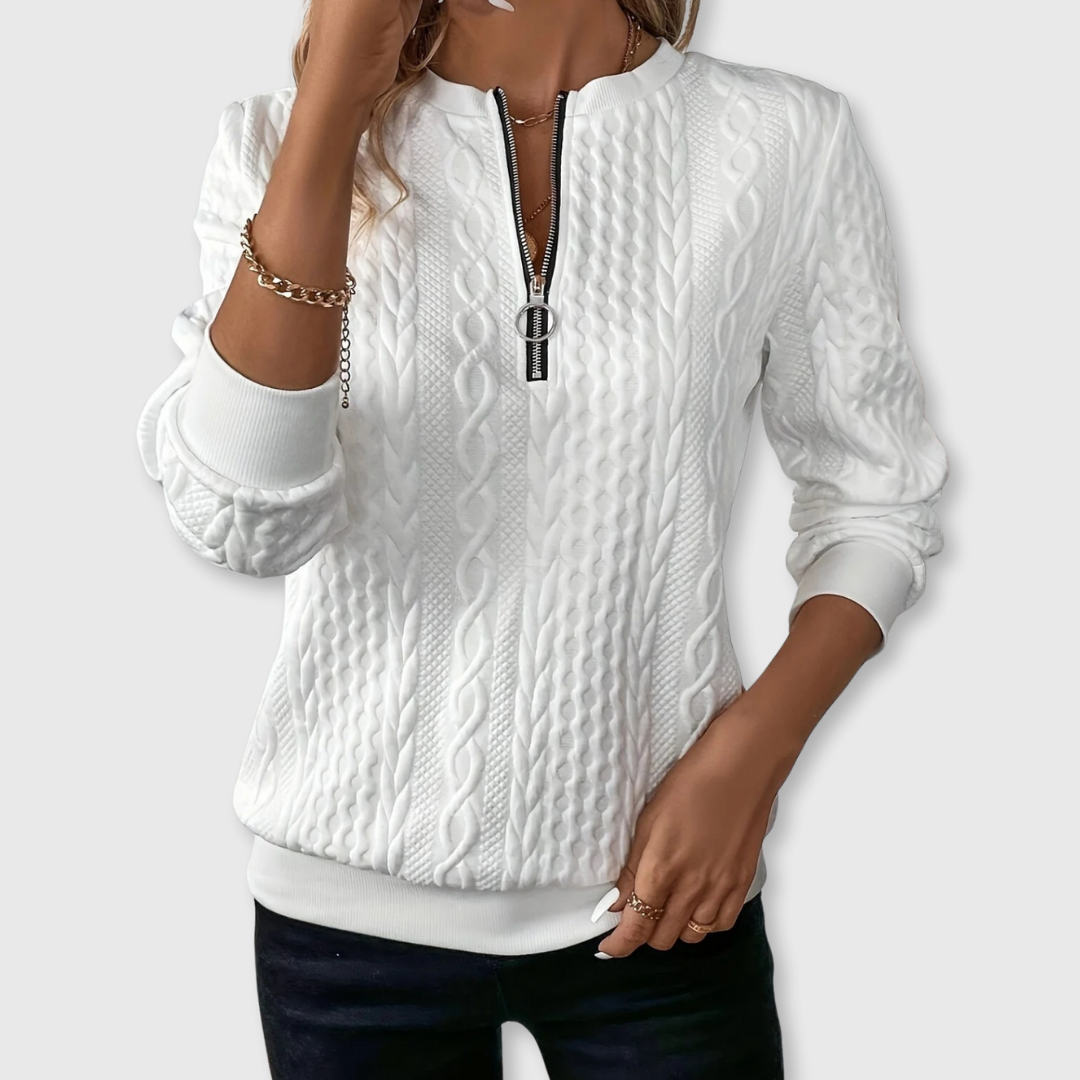 Women's textured cable knit sweater with round neckline and quarter-zip fastening