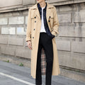 Men's long double-breasted trench coat with notched lapel, belt and flap pockets