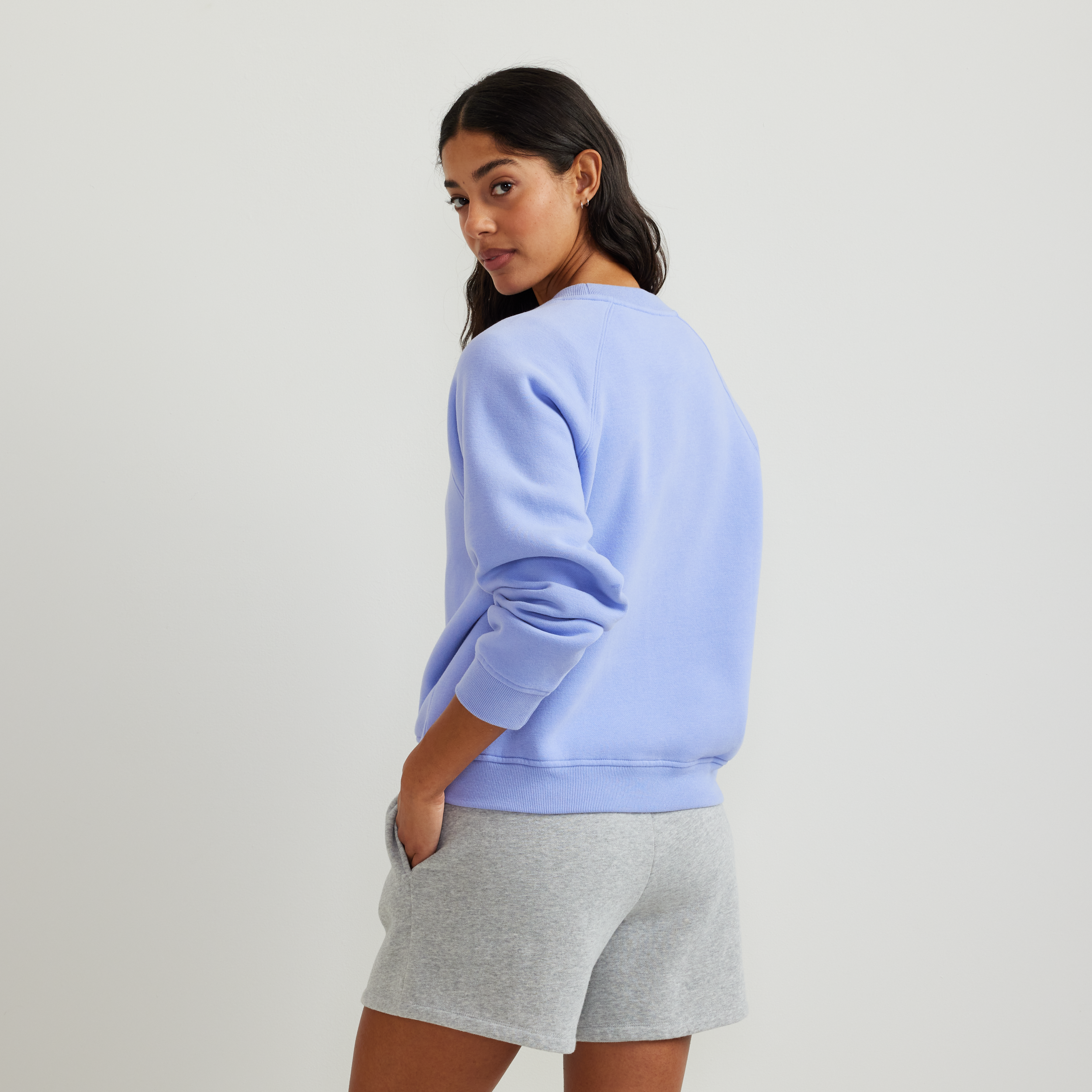Women's crew neck sweatshirt with long raglan sleeves and ribbed trims