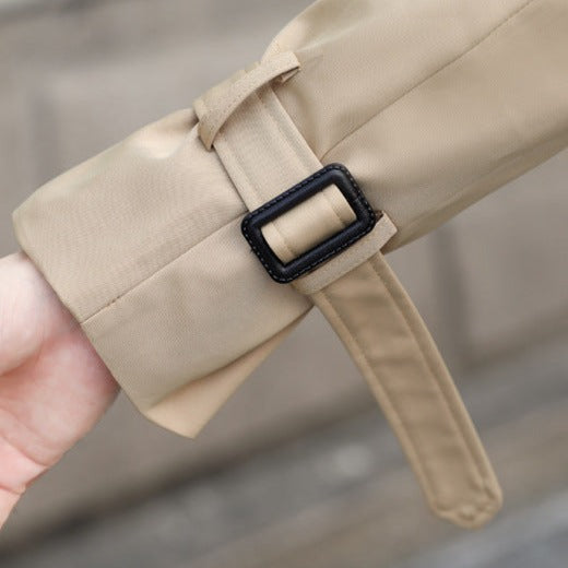 Men's long double-breasted trench coat with notched lapel, belt and flap pockets