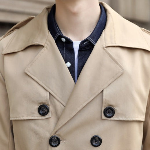 Men's long double-breasted trench coat with notched lapel, belt and flap pockets
