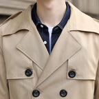 Men's long double-breasted trench coat with notched lapel, belt and flap pockets
