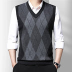 Men's sleeveless argyle V-neck sweater vest layered over a white shirt
