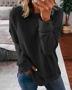 Women's crew neck sweatshirt with curved side slit hem
