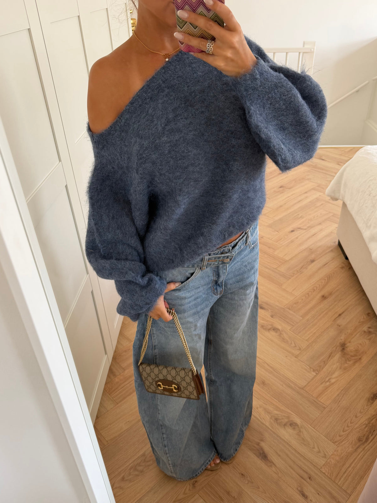 Women's blue off-shoulder jumper with long sleeves and ribbed trims