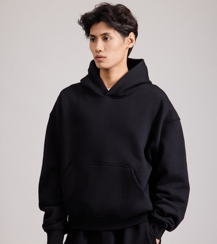 Men's black pullover hoodie with hood and front pouch pocket