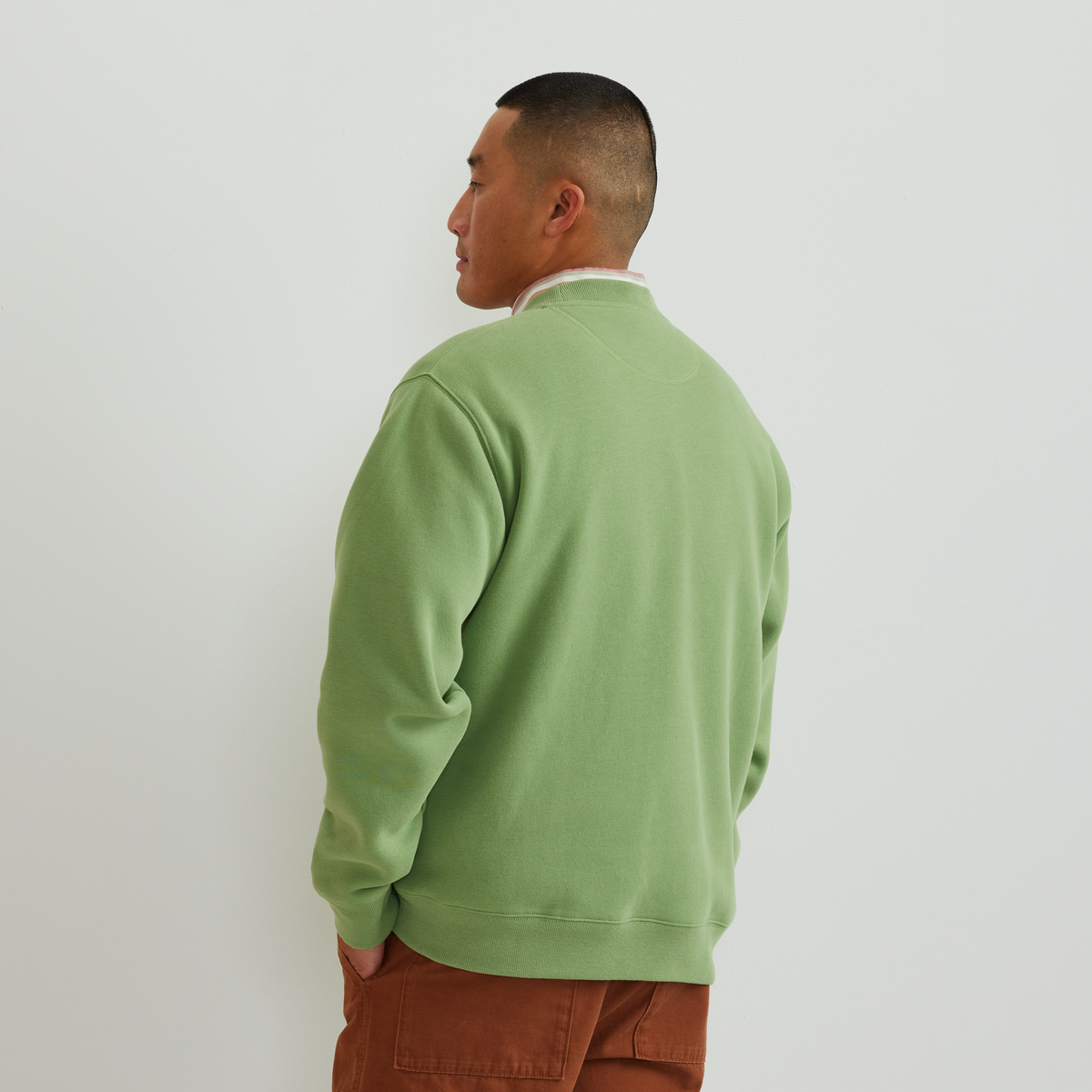 Men's green crew-neck sweatshirt with vintage Sport Shop graphic and long sleeves