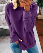 Women's crew neck sweatshirt with curved side slit hem