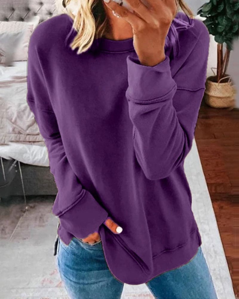 Women's crew neck sweatshirt with curved side slit hem