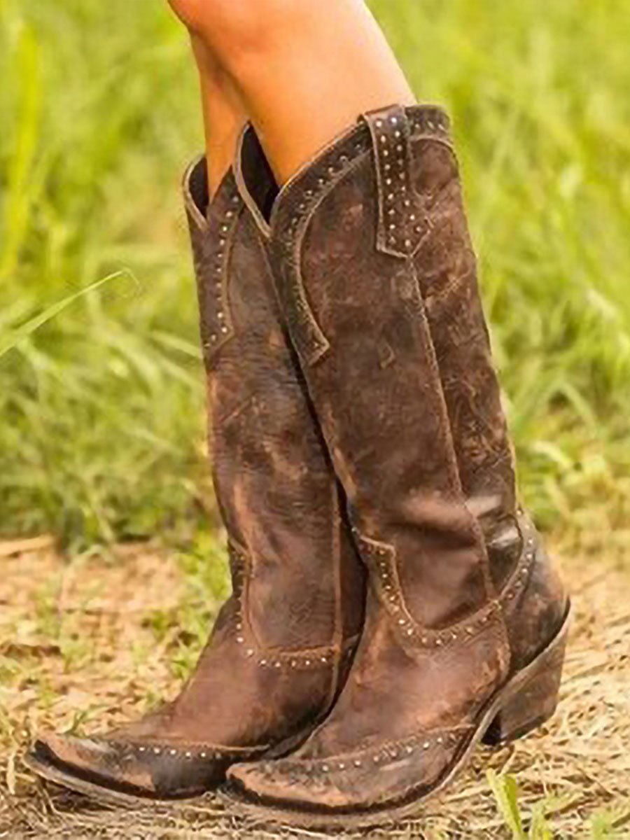 Women's studded knee-high cowboy boots with pointed toes