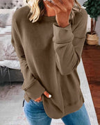 Women's crew neck sweatshirt with curved side slit hem