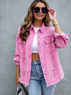 Women's pink distressed denim jacket with pockets and frayed hem