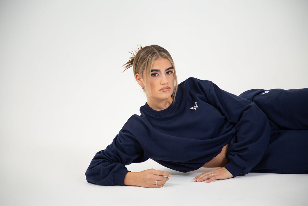 Women's navy cropped crew neck sweatshirt with long sleeves