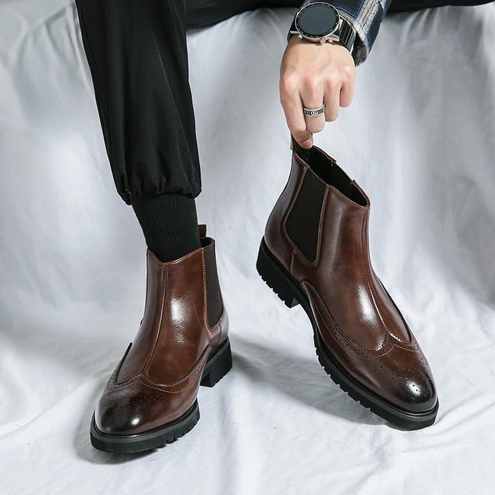 Chelsea boots with brogue toe detailing, elastic side panels and lugged soles