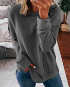 Women's crew neck sweatshirt with curved side slit hem