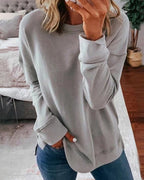 Women's crew neck sweatshirt with curved side slit hem