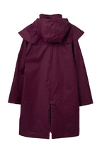 Women's hooded long raincoat with cape overlay and button front