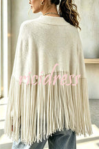 Women's knit cape sweater with crew neck and long tassel hem
