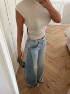 Women's light blue high-rise wide leg jeans with front pockets and full-length hems