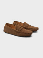 Men's suede boat loafers with rounded moc toe and penny strap detail