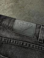 Dark washed wide leg jeans with dragon and floral embroidery