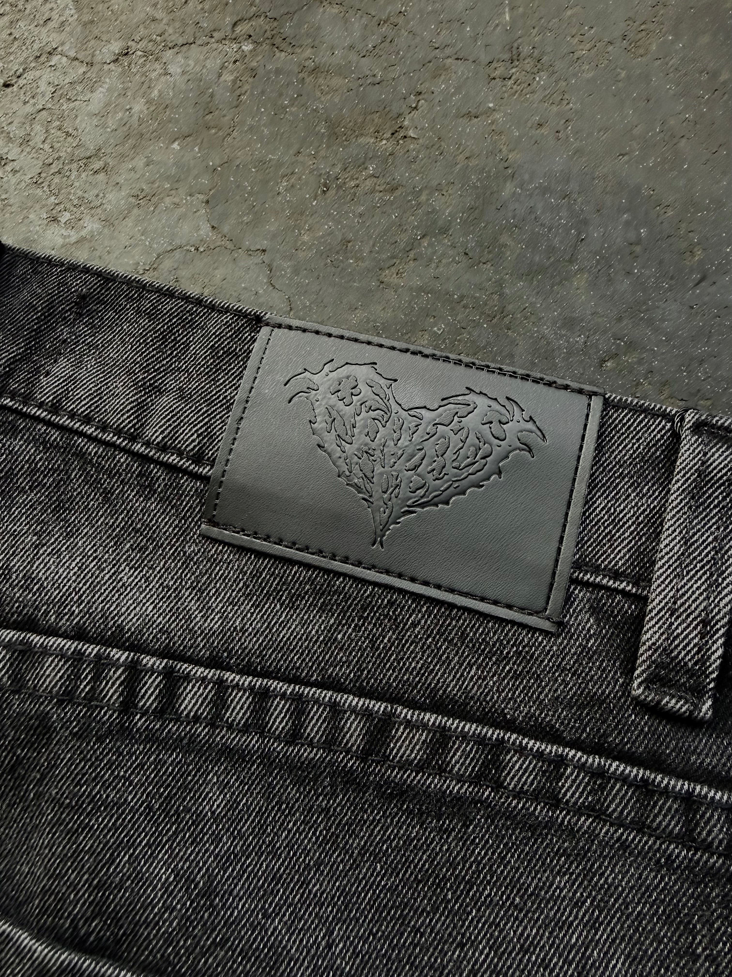 Dark washed wide leg jeans with dragon and floral embroidery