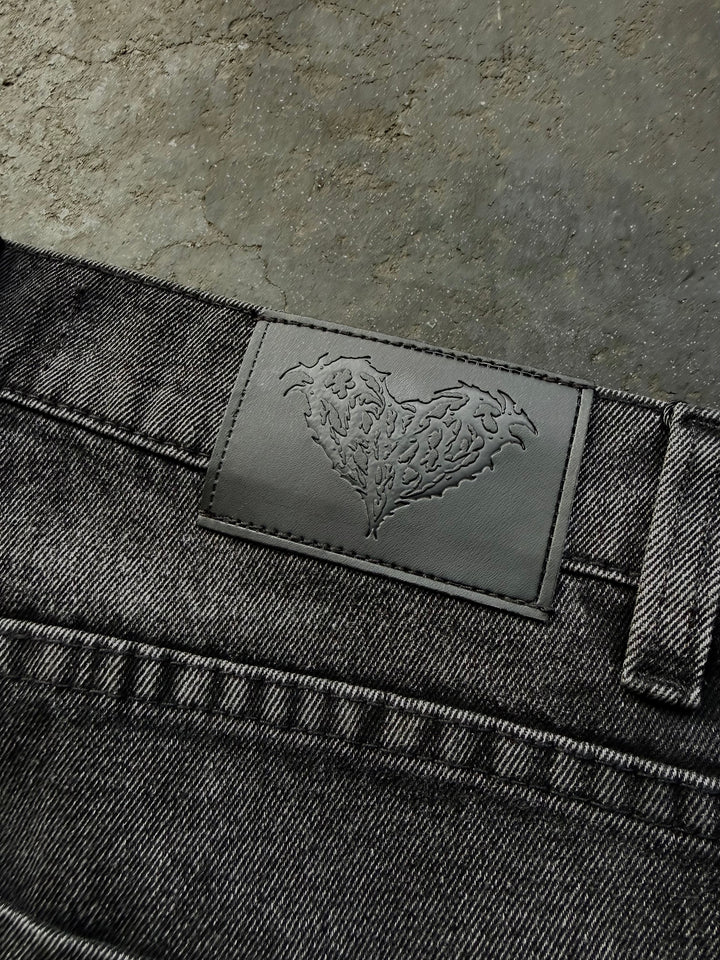 Dark washed wide leg jeans with dragon and floral embroidery