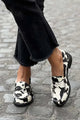 Women's black and white cow print patchwork loafers