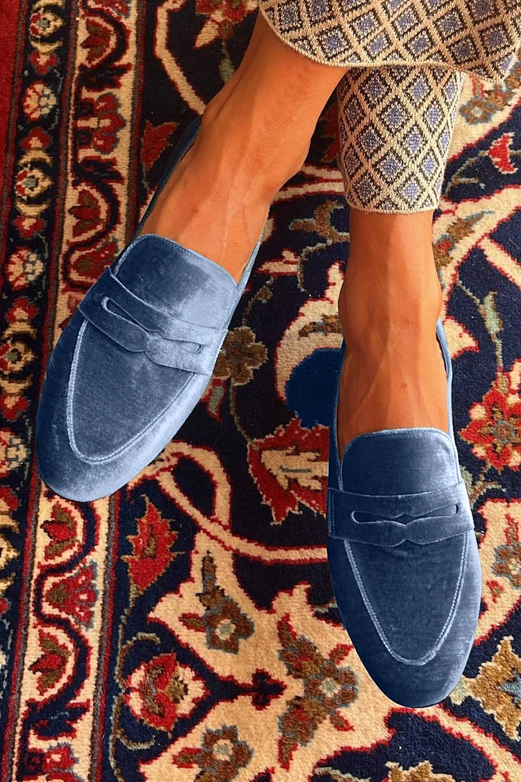 Blue women's slip-on loafers with layered vamp bands and visible stitch detailing