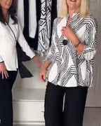 Women's black geometric pleated blouse with V-neckline and long sleeves