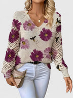 Women's floral V-neck sweater with long sleeves and open-knit sleeve panels
