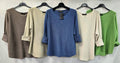 Women's fine-knit top with crew neckline, long sleeves, rolled cuffs and curved hem