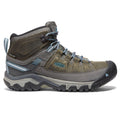 Green and grey lace-up waterproof hiking boots with chunky lugged soles
