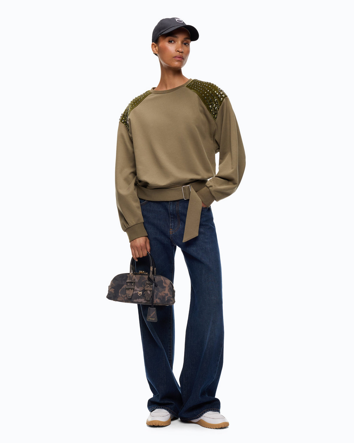 Women's green crew neck sweatshirt with embellished shoulder panels