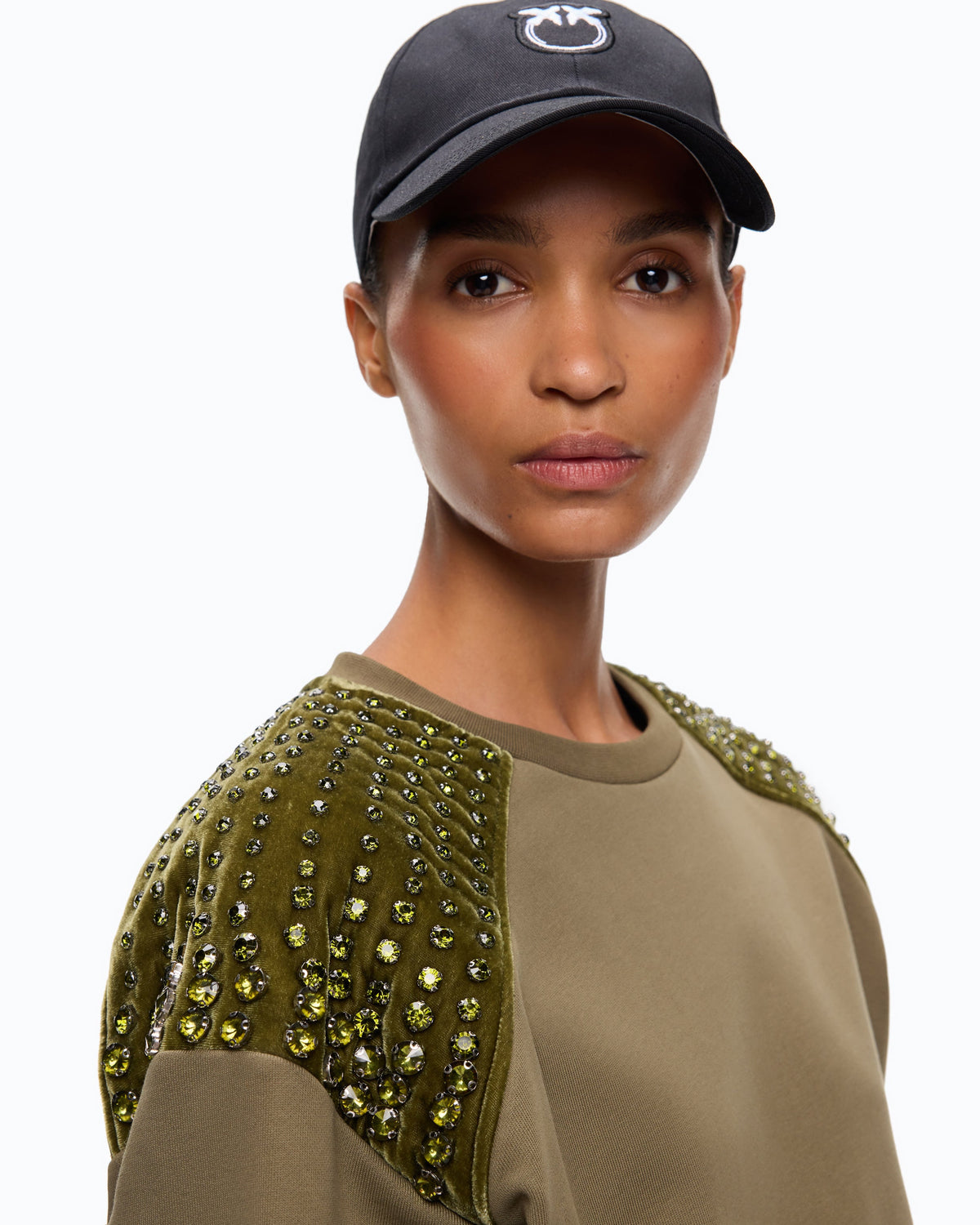Women's green crew neck sweatshirt with embellished shoulder panels
