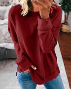 Women's crew neck sweatshirt with curved side slit hem