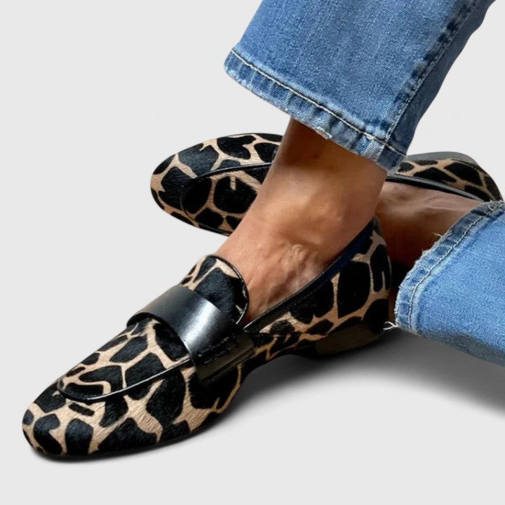 Women's leopard print loafers with black strap and low heel