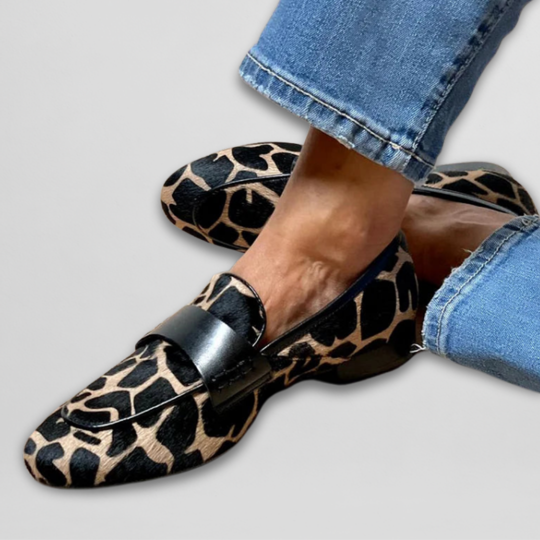 Women's leopard print loafers with black vamp strap