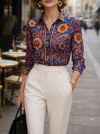 Women's blue floral button blouse with pointed collar and long sleeves