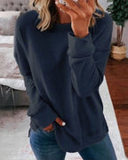 Women's crew neck sweatshirt with curved side slit hem