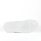 White low-top leather sneakers with laces and thick flat soles