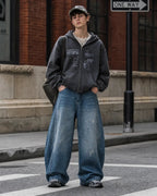 Distressed baggy jeans with wide legs and stitched panel details