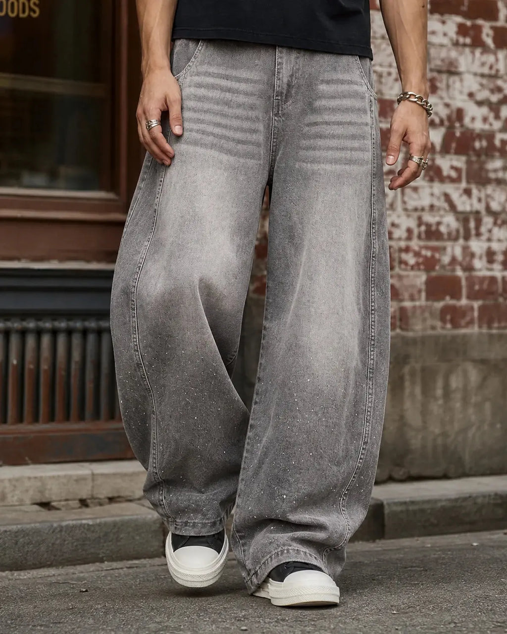 Light gray washed wide-leg jeans with rhinestone lower-leg detail