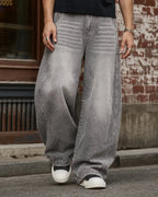 Light gray washed wide-leg jeans with rhinestone lower-leg detail