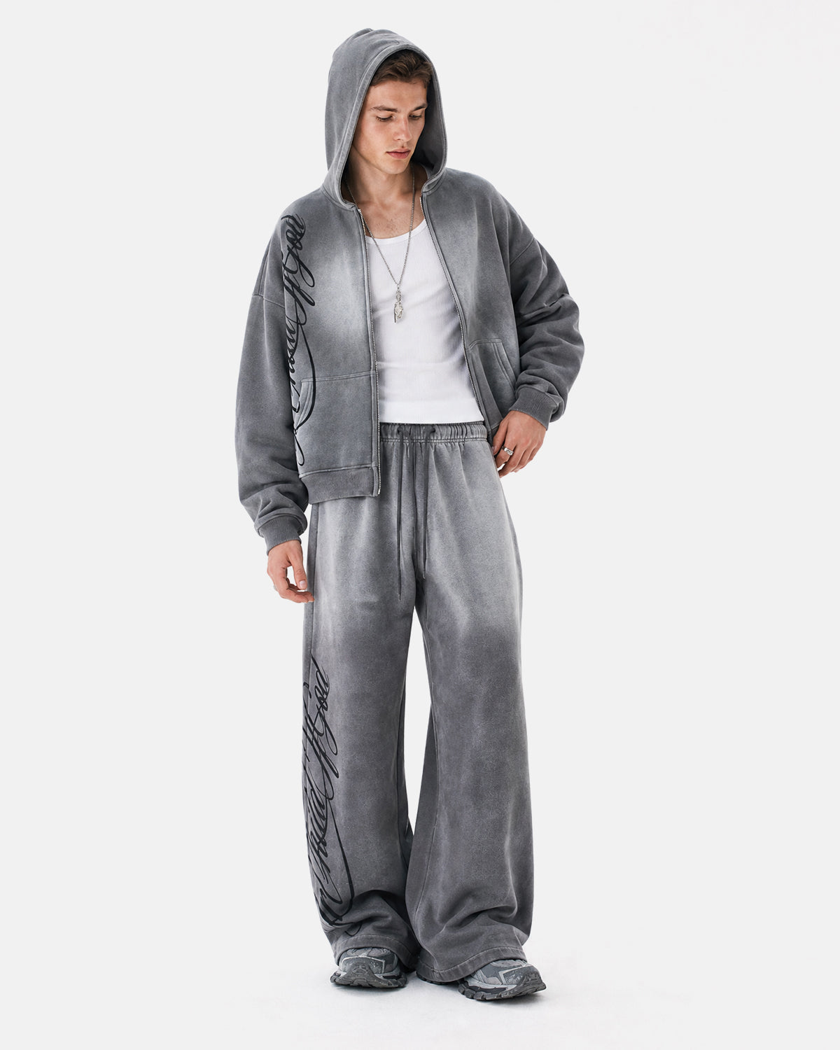 Men's grey acid-wash zip-up hoodie with hood, graphic print and front pockets