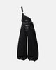 Black denim bib jeans with asymmetric shoulder strap, buckle details and wide legs