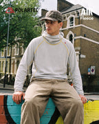 High-neck hooded pullover with long sleeves and contrast seam detailing