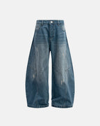 Distressed baggy jeans with wide legs and stitched panel details