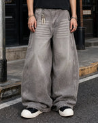 Light gray washed wide-leg jeans with rhinestone lower-leg detail